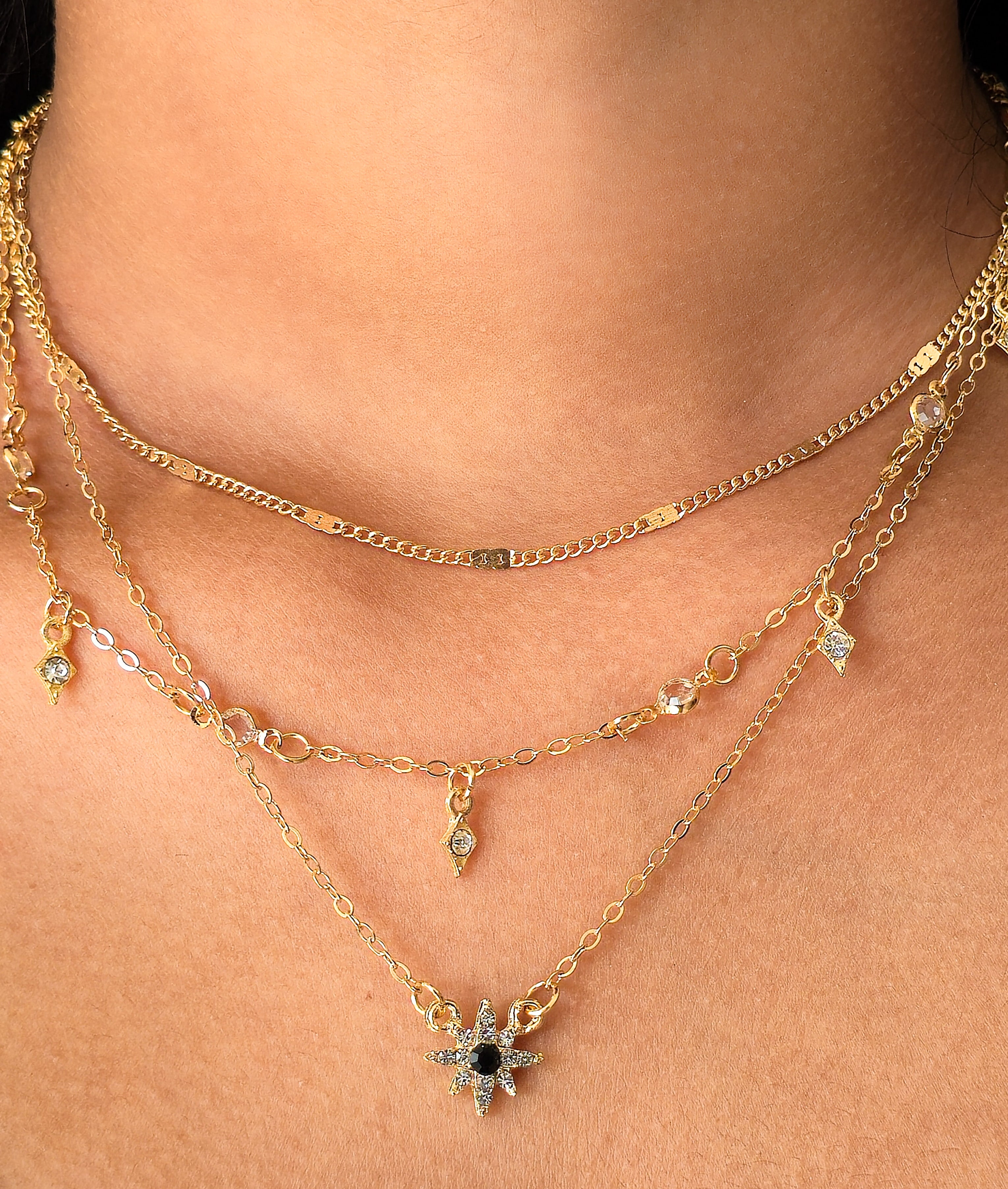 model wearing celestial multi layer star pendant gold coated necklace jewelry by rayona india