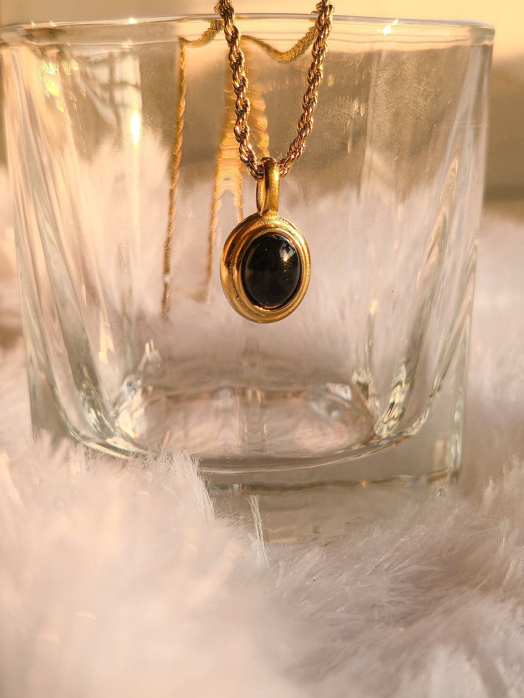 Minimal black stone gold pendant necklace close-up by rayona offical