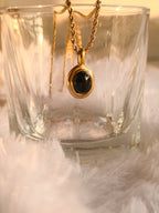 Minimal black stone gold pendant necklace close-up by rayona offical