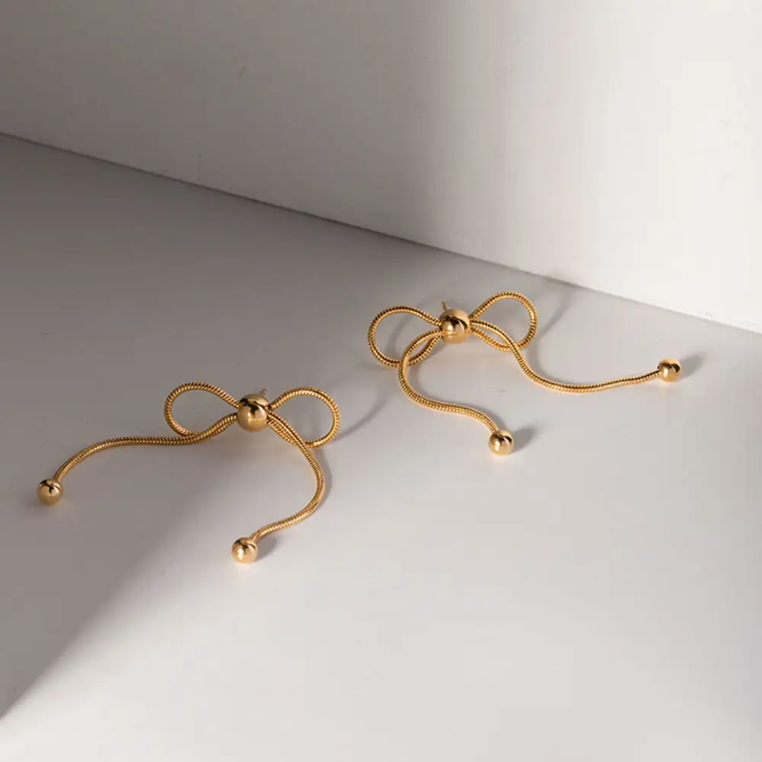 flat image of Celestial Bow Earrings – gold plated bow studs by Rayona