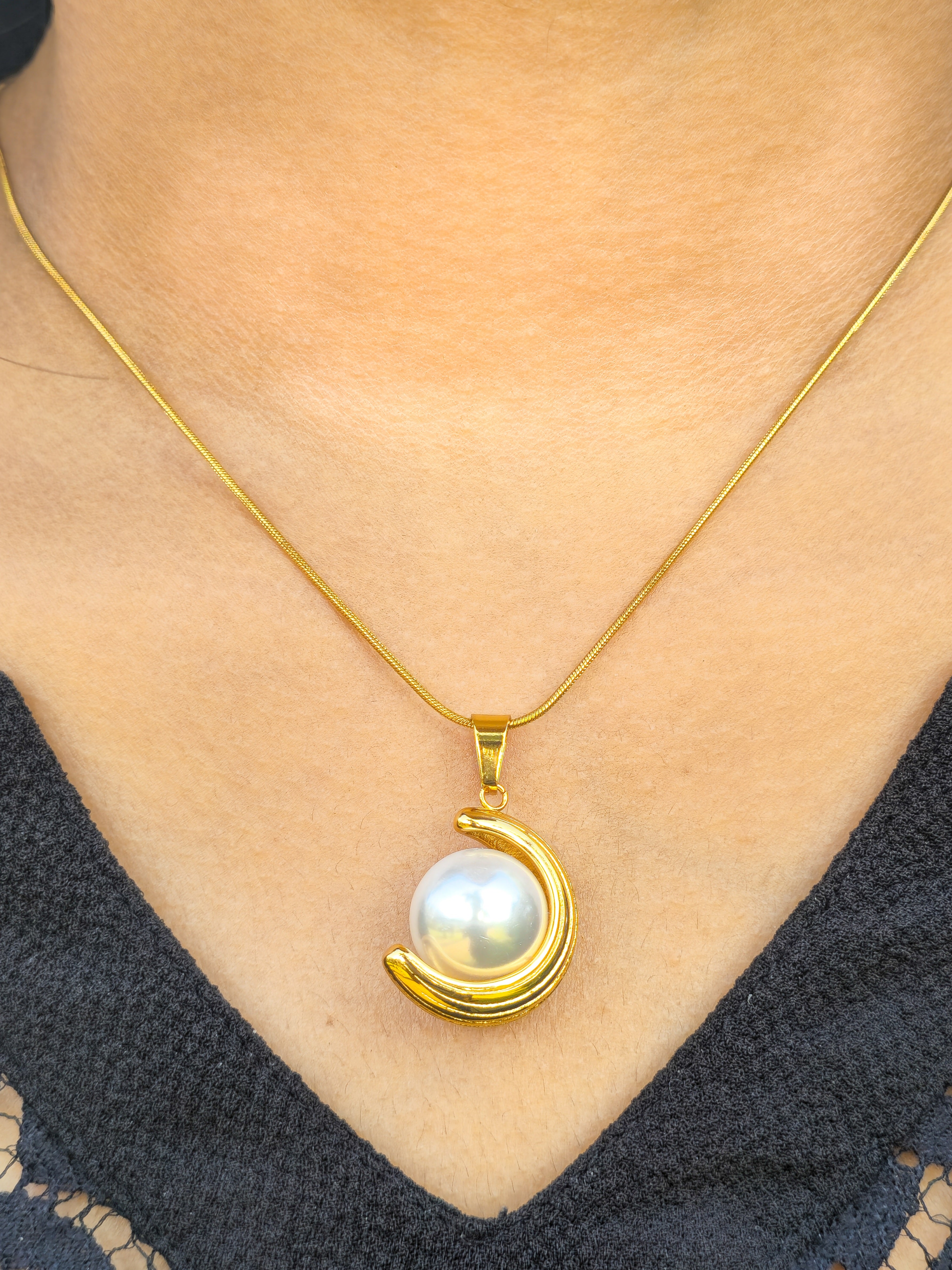 model wearing 18k gold stainless steel crescent necklace 