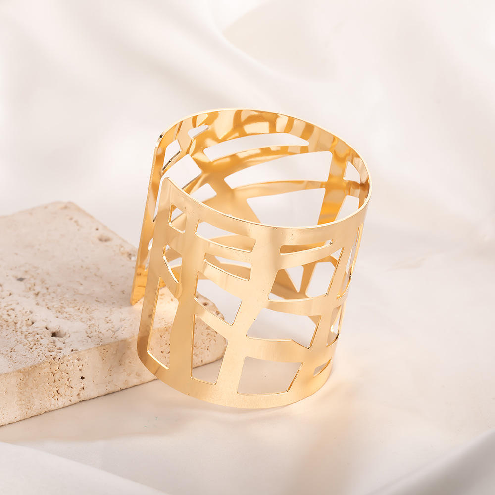 Close-up of Gilded Maze Cuff – gold-plated bracelet with geometric cutout design by Rayona