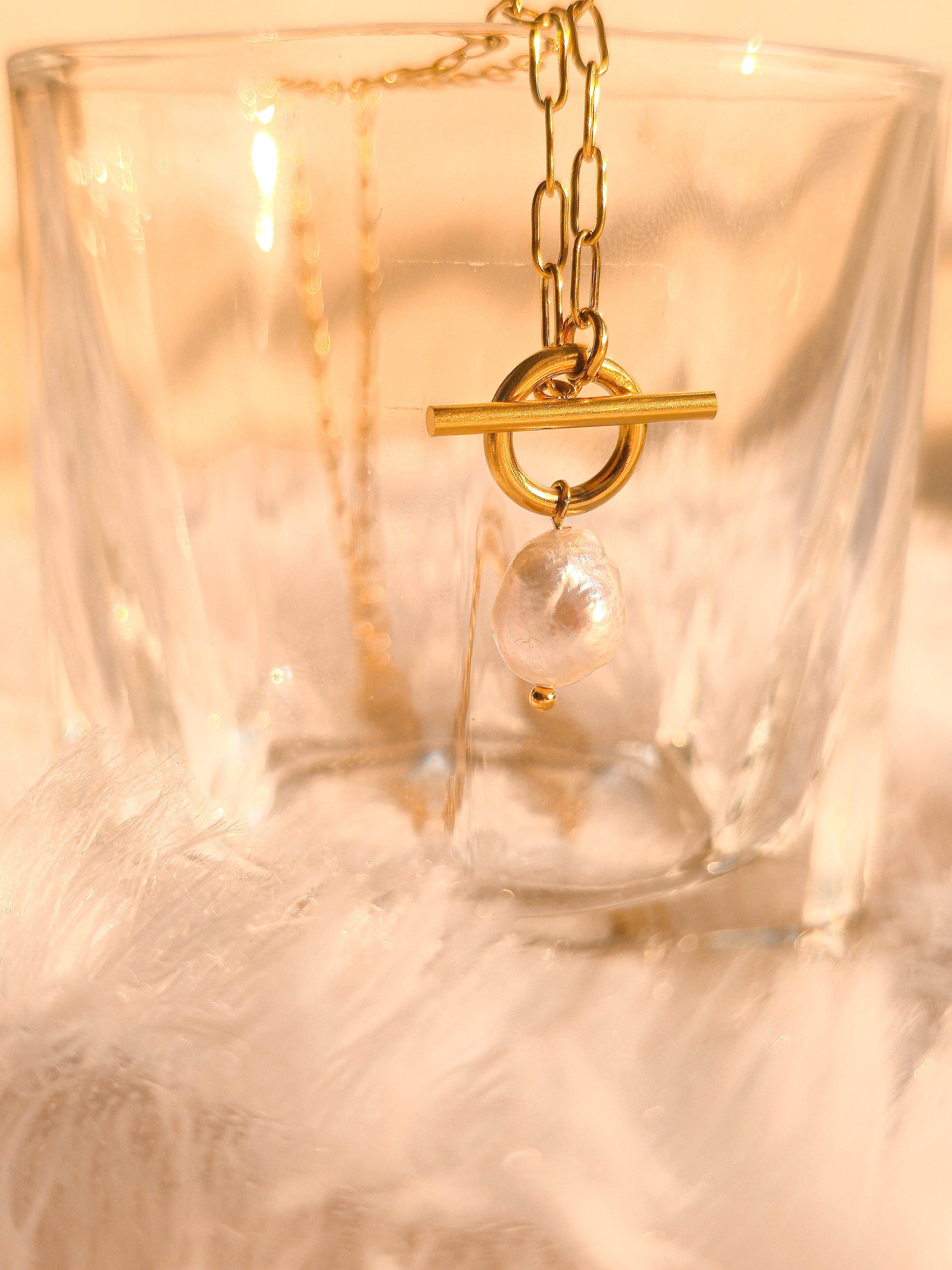 Necklace on glass with sunlight – twin pendant pearl collar design with gold coating by Rayona