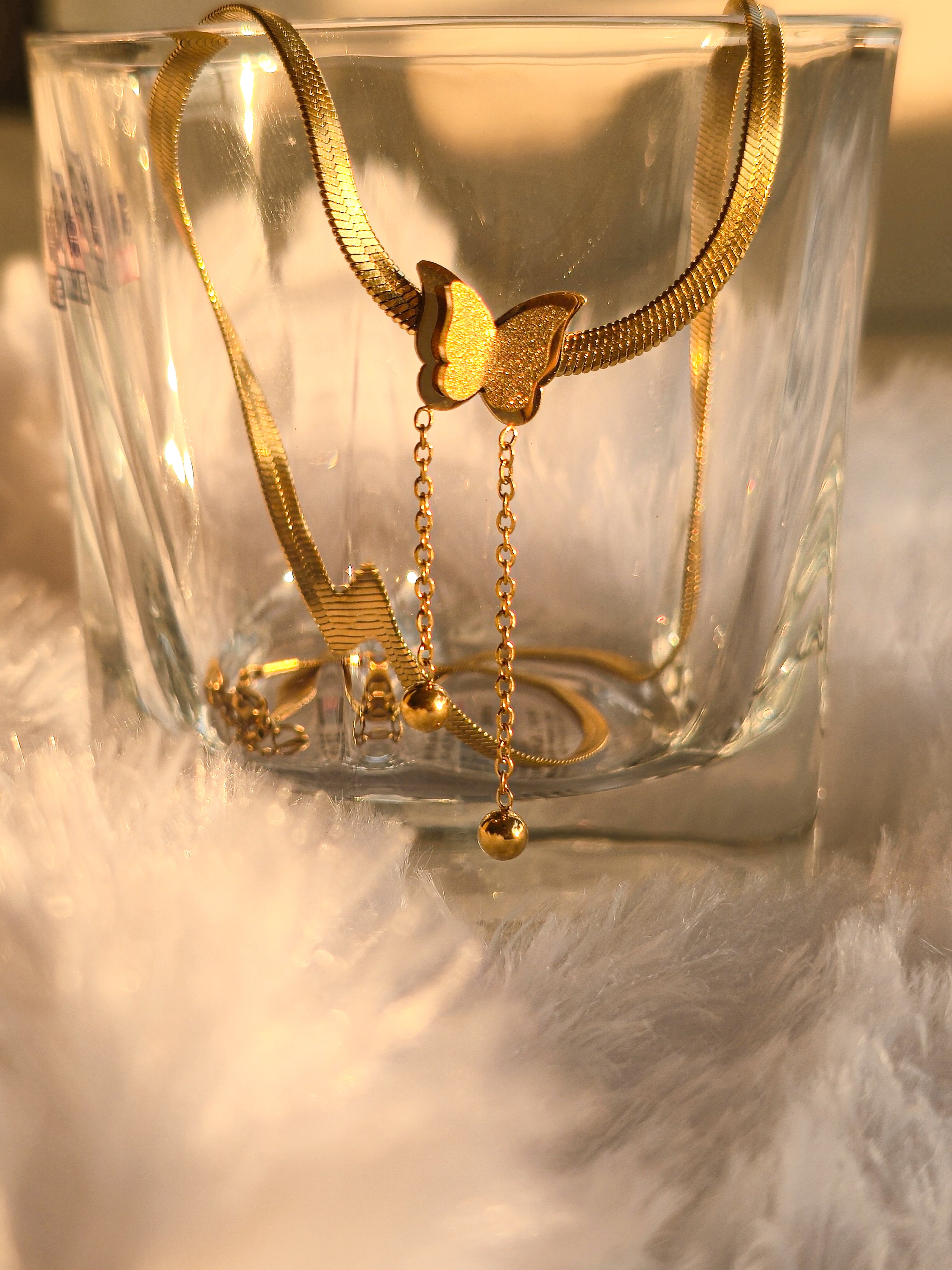 Close-up of Twin Wings buuterfly Necklace – double butterfly gold pendant by Rayona