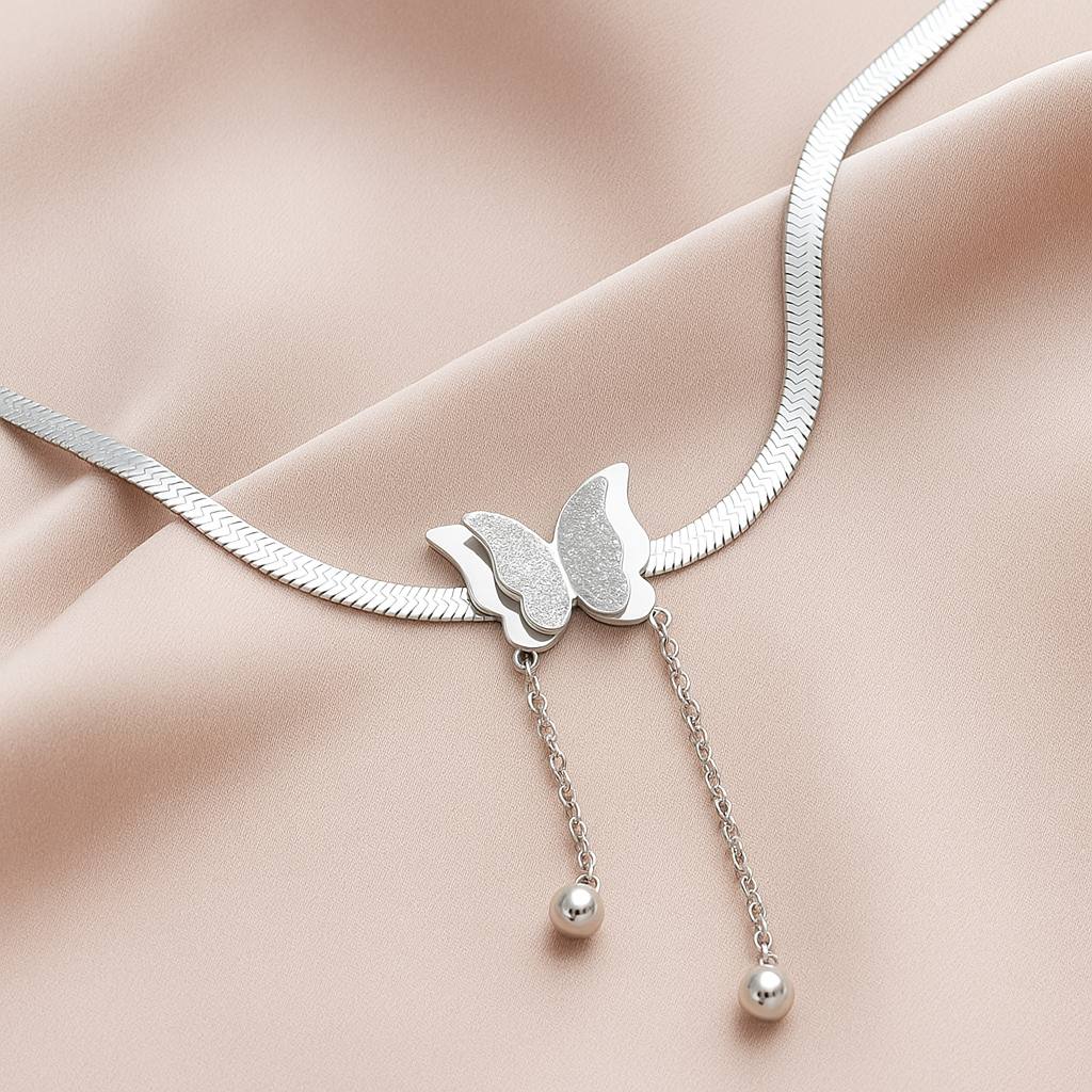 Close-up of Twin Wings butterfly Necklace – double-wing silver butterfly pendant by Rayona for women